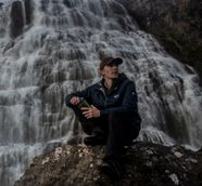 Ian Hunt Observing a Water Fall in Iceland